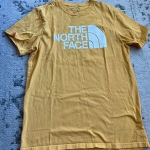Men’s yellow North Face tshirt